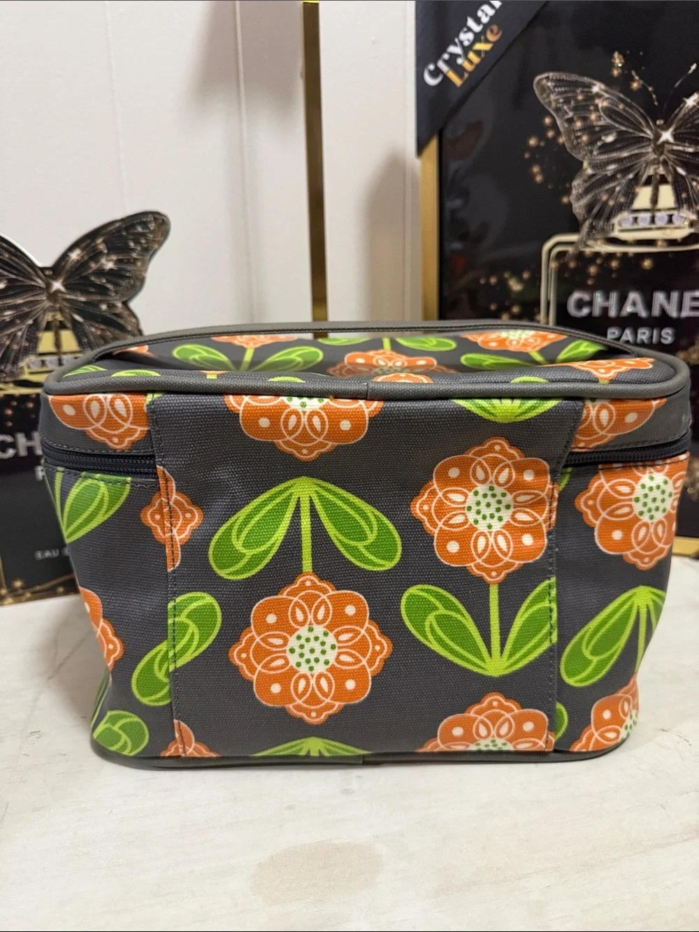 Petunia Pickle Bottom Gray Cosmetic Case with Orange Floral & Green Leaves